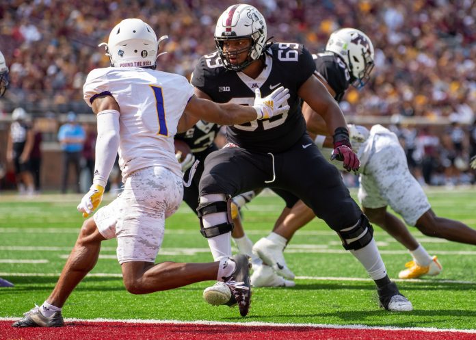 Minnesota Golden Gophers offensive lineman Aireontae Ersery (69) blocks Western Illinois Leathernecks defensive back JJ Ross (1) in the second quarter at Huntington Bank Stadium. Mandatory Credit: Matt Blewett-USA TODAY Sports