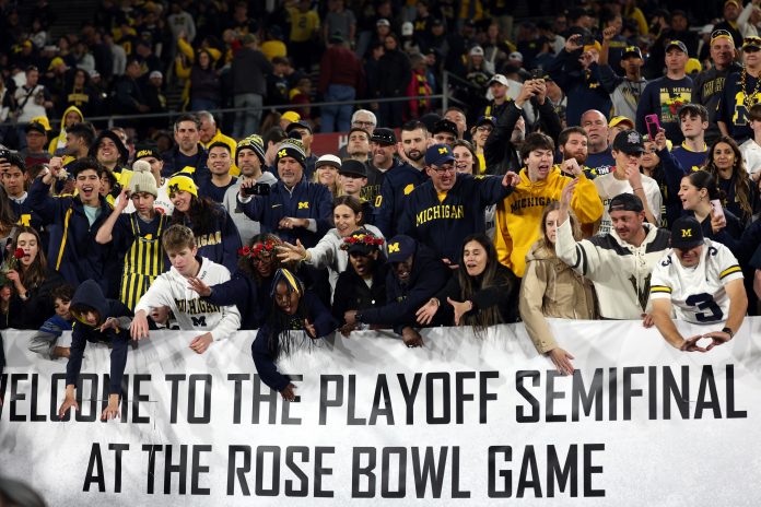 The Michigan Wolverines fans celebrate after defeating the Alabama Crimson Tide in the 2024 Rose Bowl college football playoff semifinal game at Rose Bowl.