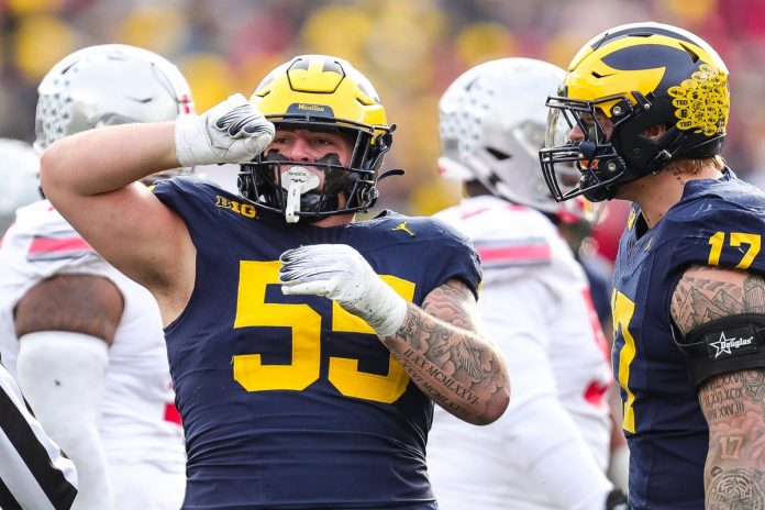 Michigan defensive lineman Mason Graham celebrates a tackle against Ohio State during the second half at Michigan Stadium in Ann Arbor on Saturday, Nov. 25, 2023.