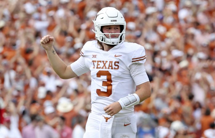 Texas Longhorns quarterback Quinn Ewers (3) reacts after touchdown during the second half against the Oklahoma Sooners at the Cotton Bowl.