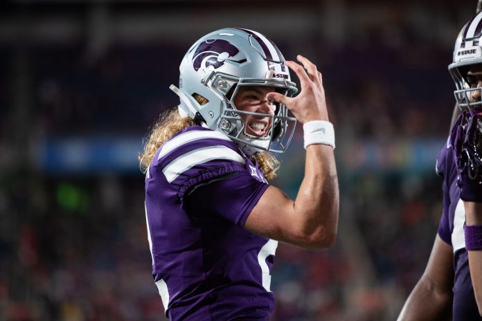 Kansas State quarterback Avery Johnson (2) celebrates his touchdown against NC State in the second quarter at Camping World Stadium.