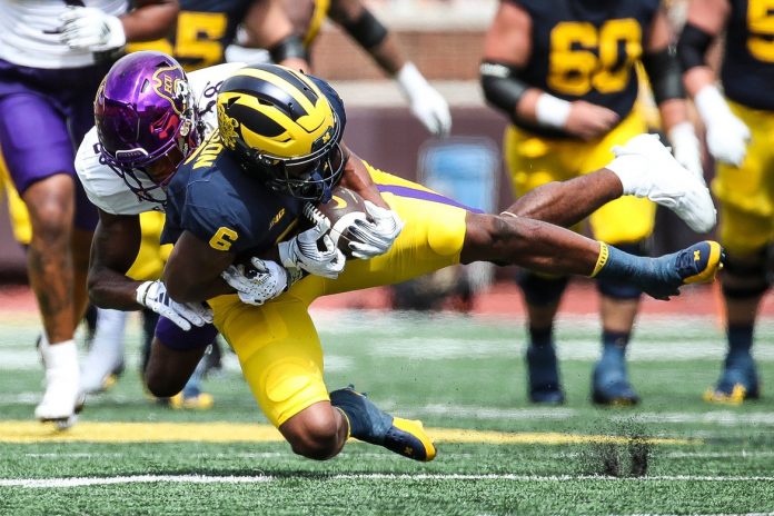 Michigan wide receiver Cornelius Johnson makes a catch against East Carolina defensive back Shavon Revel.