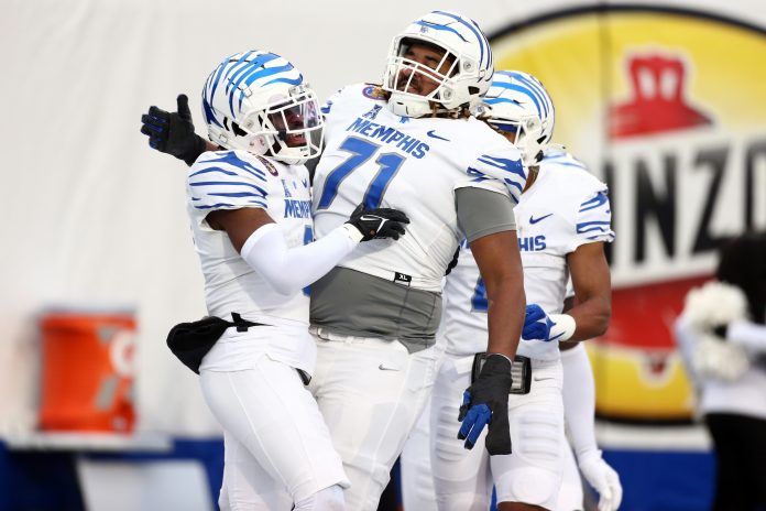 Memphis Tigers wide receiver Demeer Blankumsee (0) reacts with offensive linemen Xavier Hill (71) after a touchdown during the first half against the Iowa State Cyclones at Simmons Bank Liberty Stadium.