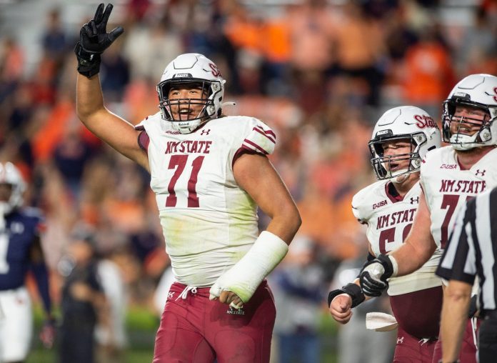 New Mexico State Aggies offensive tackle Shiyazh Pete (71) celebrates the game sealing touchdown as Auburn Tigers take on New Mexico State Aggies at Jordan-Hare Stadium.