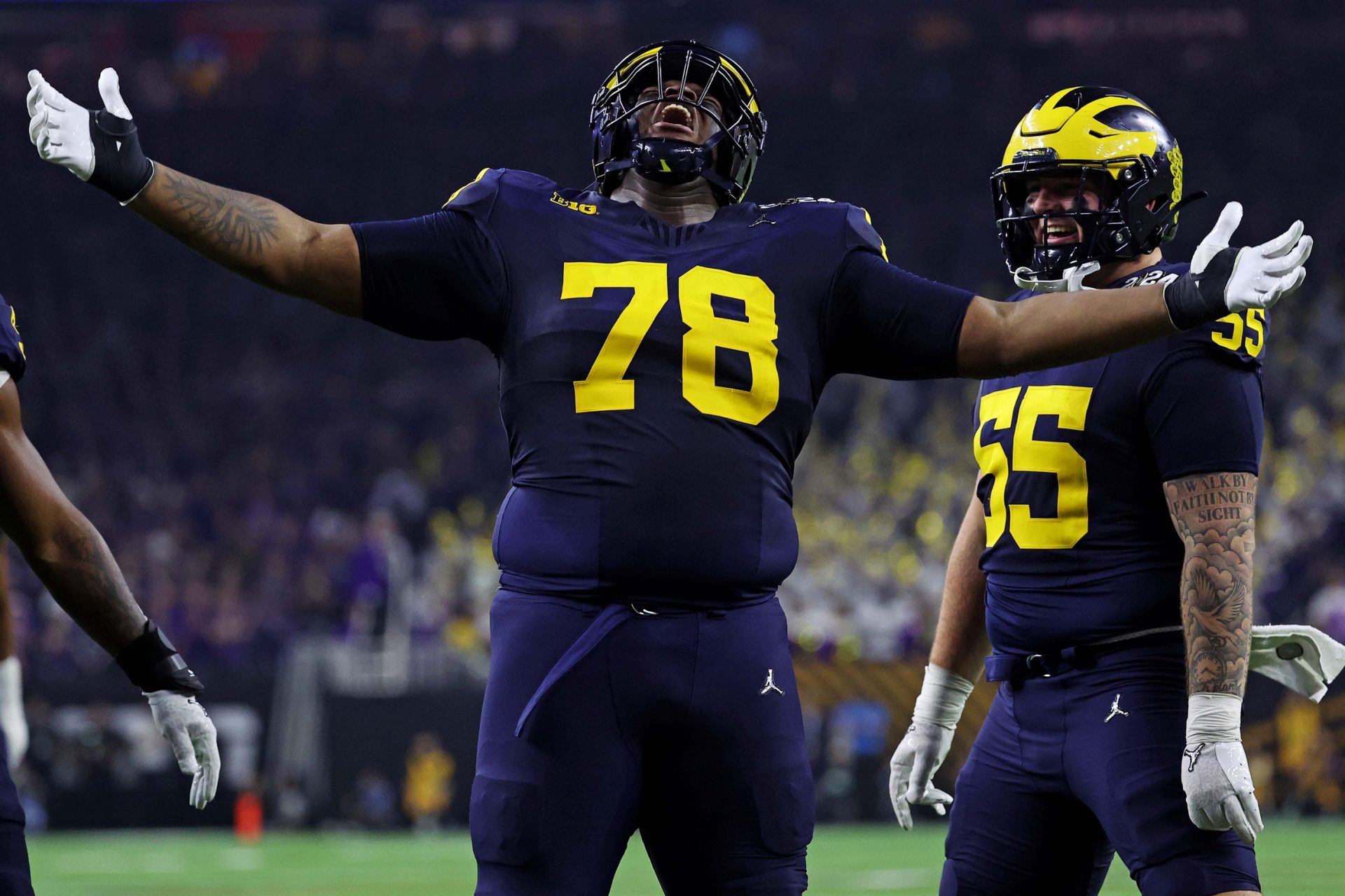 Michigan Wolverines defensive lineman Kenneth Grant (78) celebrates after a sack during the second quarter against the Washington Huskies in the 2024 College Football Playoff national championship game at NRG Stadium.