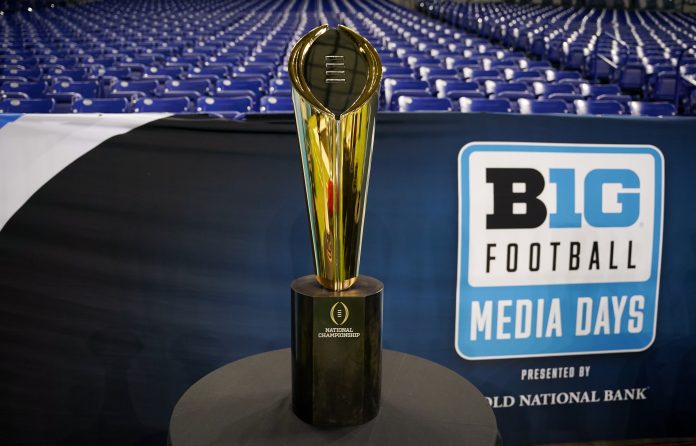 The National Championship trophy is displayed during the Big 10 football media day at Lucas Oil Stadium.