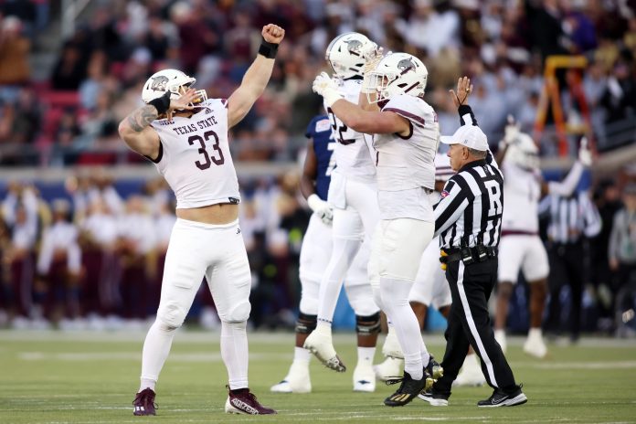 Dec 26, 2023; Dallas, TX, USA; Texas State Bobcats defensive end Ben Bell (33) reacts after making a sack against the Rice Owls in the first quarter at Gerald J Ford Stadium. Mandatory Credit: Tim Heitman-USA TODAY Sports