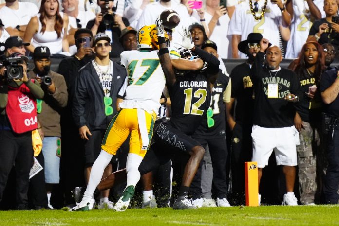 Colorado Buffaloes wide receiver Travis Hunter (12) pulls in a touchdown reception past North Dakota State Bison cornerback Jailen Duffie (17) in the second half at Folsom Field.