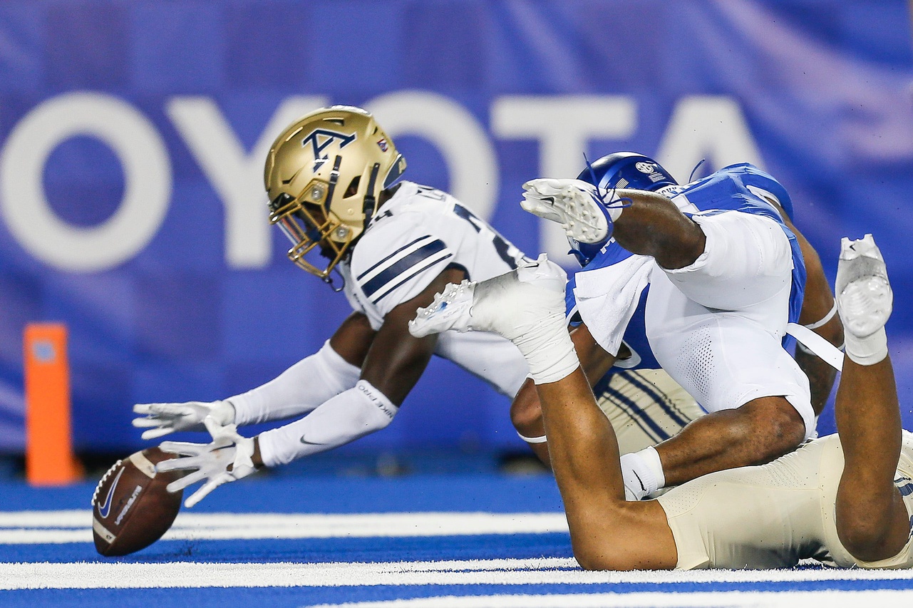 Akron Zips cornerback Darrian Lewis (24) recovers a fumble by Kentucky Wildcats tight end Jordan Dingle (85) in the second quarter for a touchback in the first half. The Cats beat Akron 35-3 in Saturday at Kroger Field in Lexington. Sept. 16, 2023