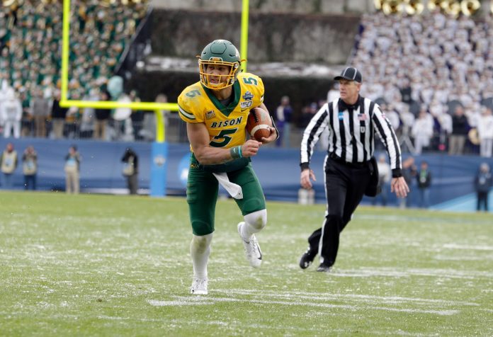 North Dakota State Bison quarterback Trey Lance (5) runs the ball in the first quarter against the James Madison Dukes at Toyota Stadium. Mandatory Credit: Tim Heitman-USA TODAY Sports