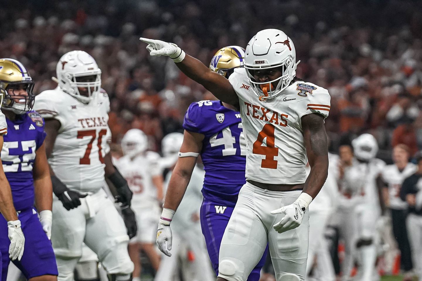 Texas Longhorns running back CJ Baxter (4) celebrates a first down during the Sugar Bowl College Football Playoff semifinals game against the Washington Huskies at the Caesars Superdome on Monday, Jan. 1, 2024 in New Orleans, Louisiana.