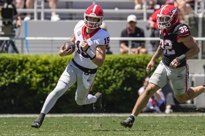 Georgia Bulldogs quarterback Carson Beck (15) runs past linebacker Chaz Chambliss (32) during the G-Day Game at Sanford Stadium. How does he figure into our Clemson vs. Georgia prediction?