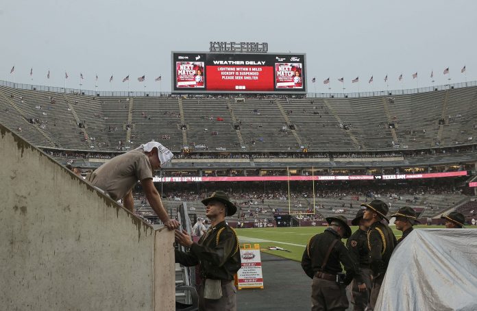 A notice of weather delay is displayed on a video board at Kyle Field before the game between the Texas A&M Aggies and the Louisiana Monroe Warhawks. Mandatory Credit: Troy Taormina-USA TODAY Sports