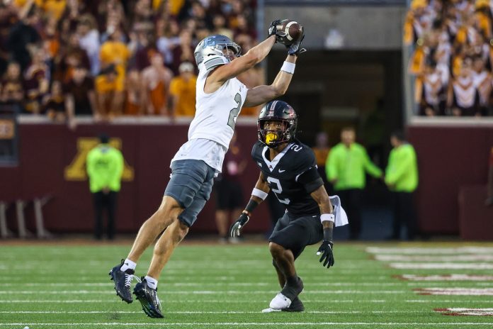 Eastern Michigan Eagles wide receiver Tanner Knue (2) makes a catch as Minnesota Golden Gophers defensive back Tre'Von Jones (2) defends during the second quarter at Huntington Bank Stadium. Mandatory Credit: Matt Krohn-USA TODAY Sports