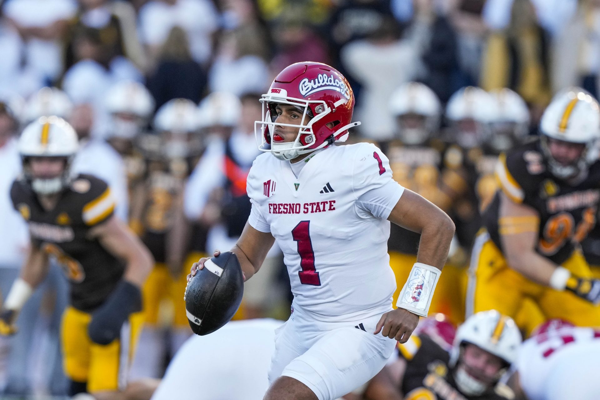 Fresno State Bulldogs quarterback Mikey Keene (1) runs with the ball against the Wyoming Cowboys during the first quarter at Jonah Field at War Memorial Stadium. Mandatory Credit: Troy Babbitt-USA TODAY Sports