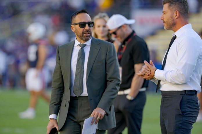 Sportscaster Joe Tessitore, left, talks with sportscaster Jesse Palmer before a game between the LSU Tigers and the Auburn Tigers at Tiger Stadium. Mandatory Credit: Matthew Hinton-USA TODAY Sports