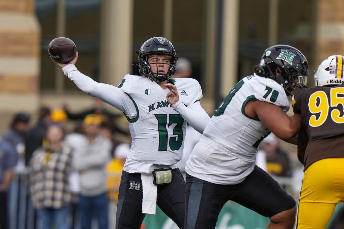 Hawaii Rainbow Warriors quarterback Brayden Schager (13) throws against the Wyoming Cowboys during the second quarter at Jonah Field at War Memorial Stadium. Mandatory Credit: Troy Babbitt-USA TODAY Sports