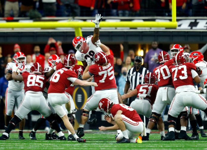 Alabama Crimson Tide place kicker Will Reichard (16) kicks a field goal Monday, Jan. 10, 2022, during the College Football Playoff National Championship against Georgia at Lucas Oil Stadium in Indianapolis.