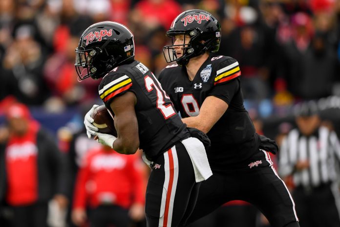 Maryland Terrapins quarterback Billy Edwards Jr. (9) hands the ball to running back Roman Hemby (24) against the Auburn Tigers during the first half at Nissan Stadium.