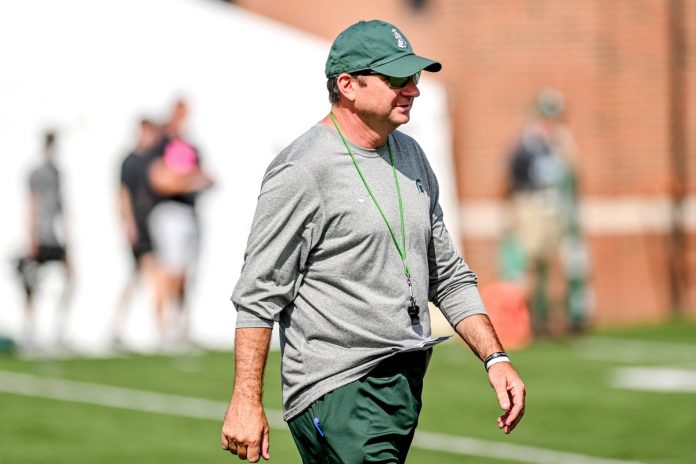 Who joins head coach Jonathan Smith on the Michigan Spartans coaching staff for the 2024 season?