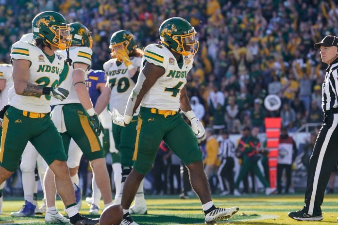 North Dakota State Bison running back Kobe Johnson (4) reacts after a play against the South Dakota State Jackrabbits during the second half of the DI Football Championship at Toyota Stadium. Mandatory Credit: Chris Jones-USA TODAY Sports