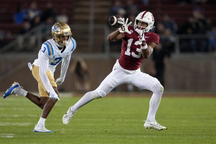 Stanford Cardinal wide receiver Elic Ayomanor (13) catches a pass against UCLA Bruins defensive back Devin Kirkwood (3) during the fourth quarter at Stanford Stadium. Mandatory Credit: Darren Yamashita-USA TODAY Sports