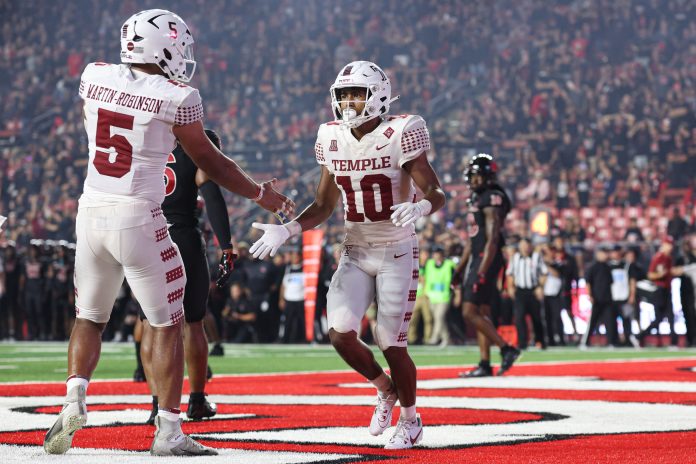 Temple Owls wide receiver Dante Wright (10) celebrates his touchdown reception with tight end David Martin-Robinson (5) during the second half against the Rutgers Scarlet Knights at SHI Stadium. Mandatory Credit: Vincent Carchietta-USA TODAY Sports