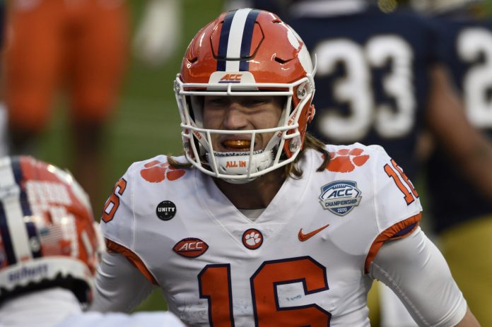 Clemson Tigers wide receiver E.J. Williams (6) celebrates with quarterback Trevor Lawrence (16) after scoring a touchdown in the second quarter at Bank of America Stadium. Mandatory Credit: Bob Donnan-USA TODAY Sports