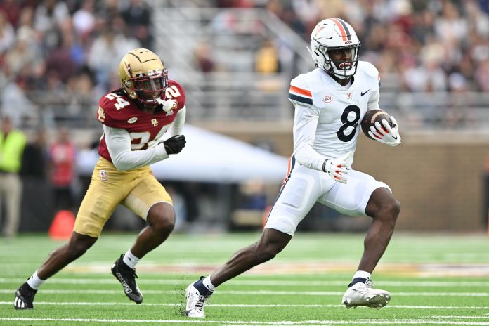 Virginia Cavaliers wide receiver Malachi Fields (8) runs with the ball in front of Boston College Eagles cornerback Amari Jackson (24) during the first half at Alumni Stadium. Mandatory Credit: Brian Fluharty-USA TODAY Sports