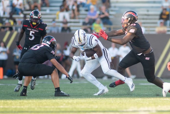 Western Michigan wide receiver Kenneth Womack runs with the ball during the season opening game against Saint Francis at Waldo Stadium on Thursday, Aug. 31, 2023.