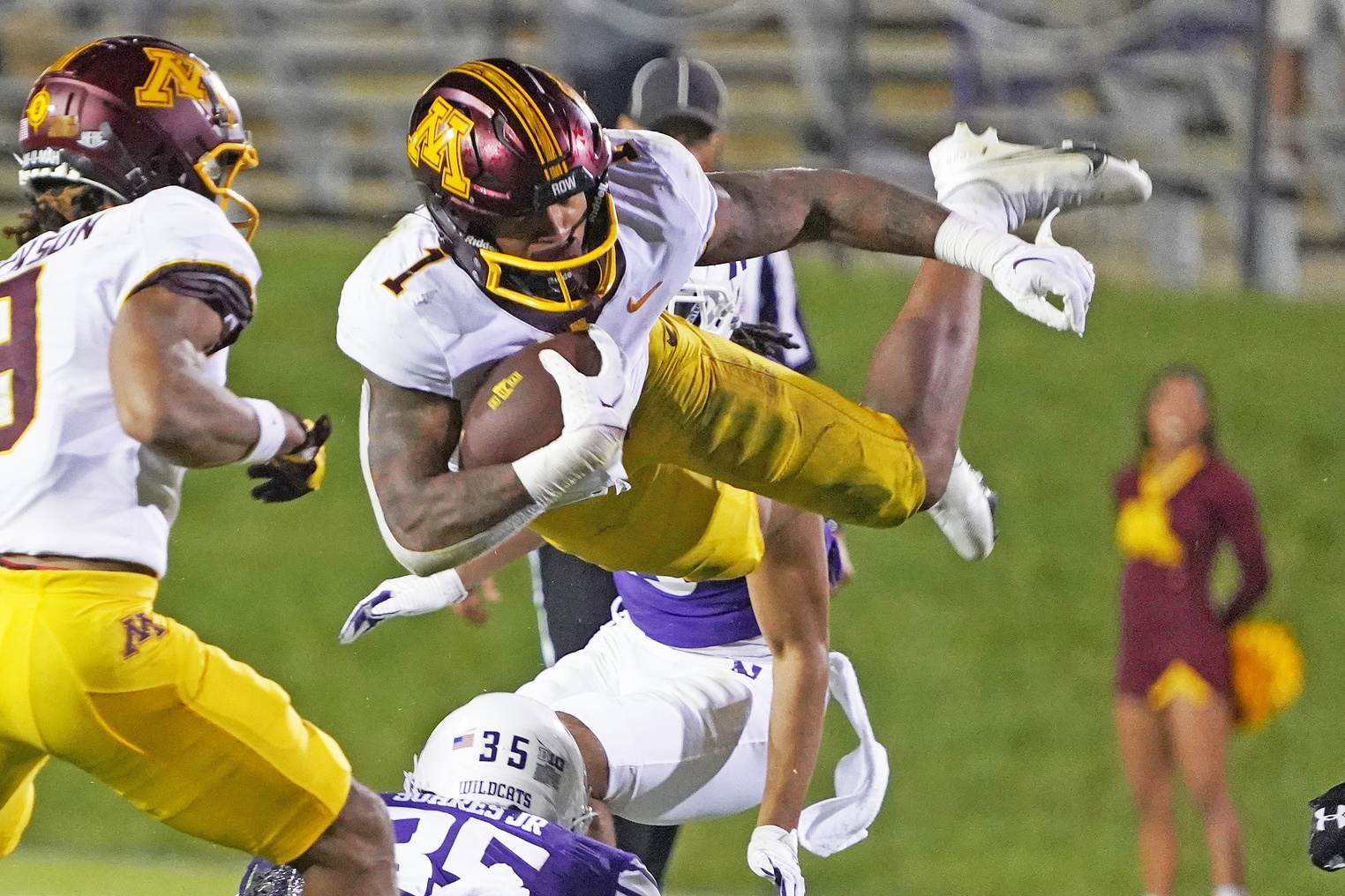 Minnesota Golden Gophers running back Darius Taylor (1) leaps over Northwestern Wildcats linebacker Kenny Soares Jr. (35) during the second half at Ryan Field. Mandatory Credit: David Banks-USA TODAY Sports