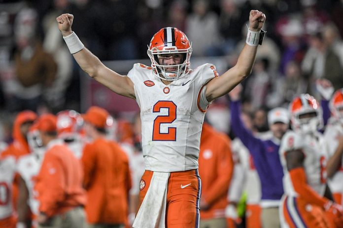 Clemson Tigers quarterback Cade Klubnik (2) raises his arms as time runs out against the South Carolina Gamecocks at Williams-Brice Stadium. Clemson won 16-7. Mandatory Credit: Ken Ruinard-USA TODAY Sports