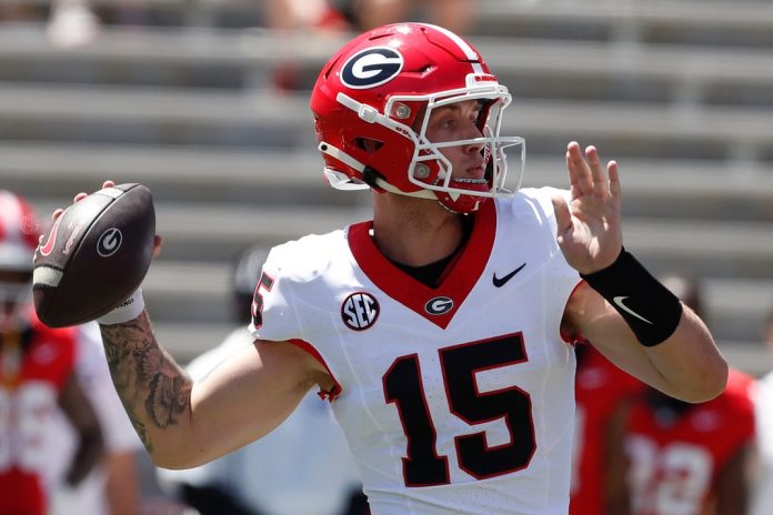 Georgia quarterback Carson Beck (15) throws a pass during the G-Day spring football game in Athens, Ga., on Saturday, April 13, 2024.