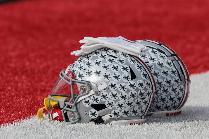 Ohio State Buckeyes helmets rest on the field before the game against the Rutgers Scarlet Knights at SHI Stadium. Mandatory Credit: Vincent Carchietta-USA TODAY Sports