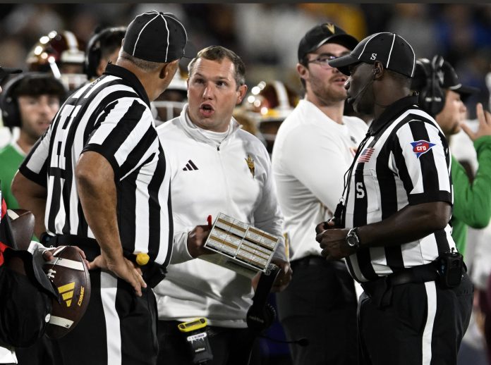 Arizona State Sun Devils head coach Kenny Dillingham exchanges words with referees on a call during the second half against the UCLA Bruins at the Rose Bowl. Mandatory Credit: Alex Gallardo-USA TODAY Sports