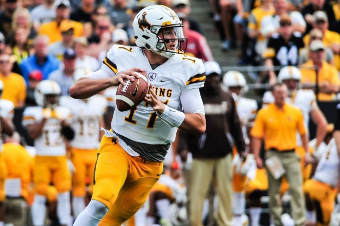 Wyoming Cowboys quarterback Josh Allen (17) prepares to throw a pass during the game between the Iowa Hawkeyes and the Wyoming Cowboys at Kinnick Stadium.