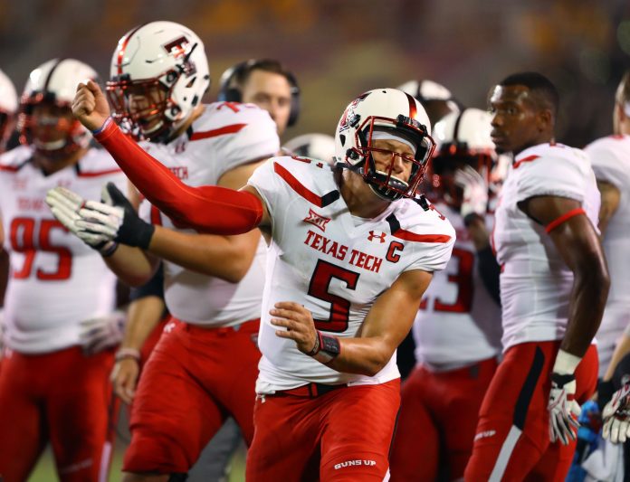 Texas Tech Red Raiders quarterback Patrick Mahomes II (5) celebrates a touchdown in the first half against the Arizona State Sun Devils at Sun Devil Stadium.