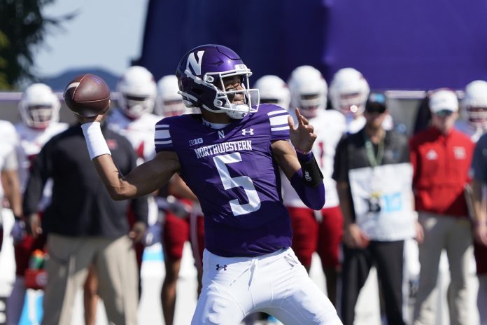 Northwestern Wildcats quarterback Mike Wright (5) looks to throw a pass against the Miami (Oh) Redhawks during the first half at Lanny and Sharon Martin Stadium.