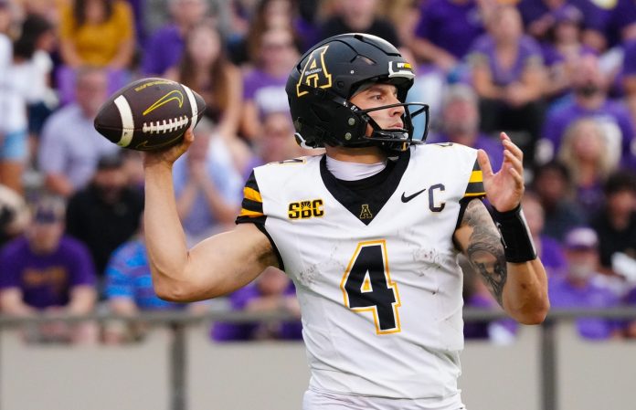 Appalachian State Mountaineers quarterback Joey Aguilar (4) goes to throw the ball against the East Carolina Pirates during the second half at Dowdy-Ficklen Stadium.