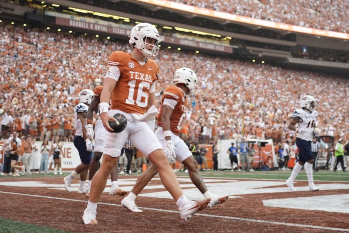 Texas Longhorns quarterback Arch Manning (16) reacts after scoring a touchdown during the first half against the Texas-San Antonio Roadrunners at Darrell K Royal-Texas Memorial Stadium.