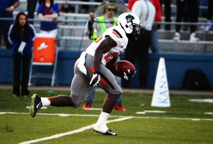 Oklahoma State Cowboys wide receiver Tyreek Hill (24) returns a kick for a touchdown against the Kansas Jayhawks in the second half at Memorial Stadium. Oklahoma State won the game 27-20.