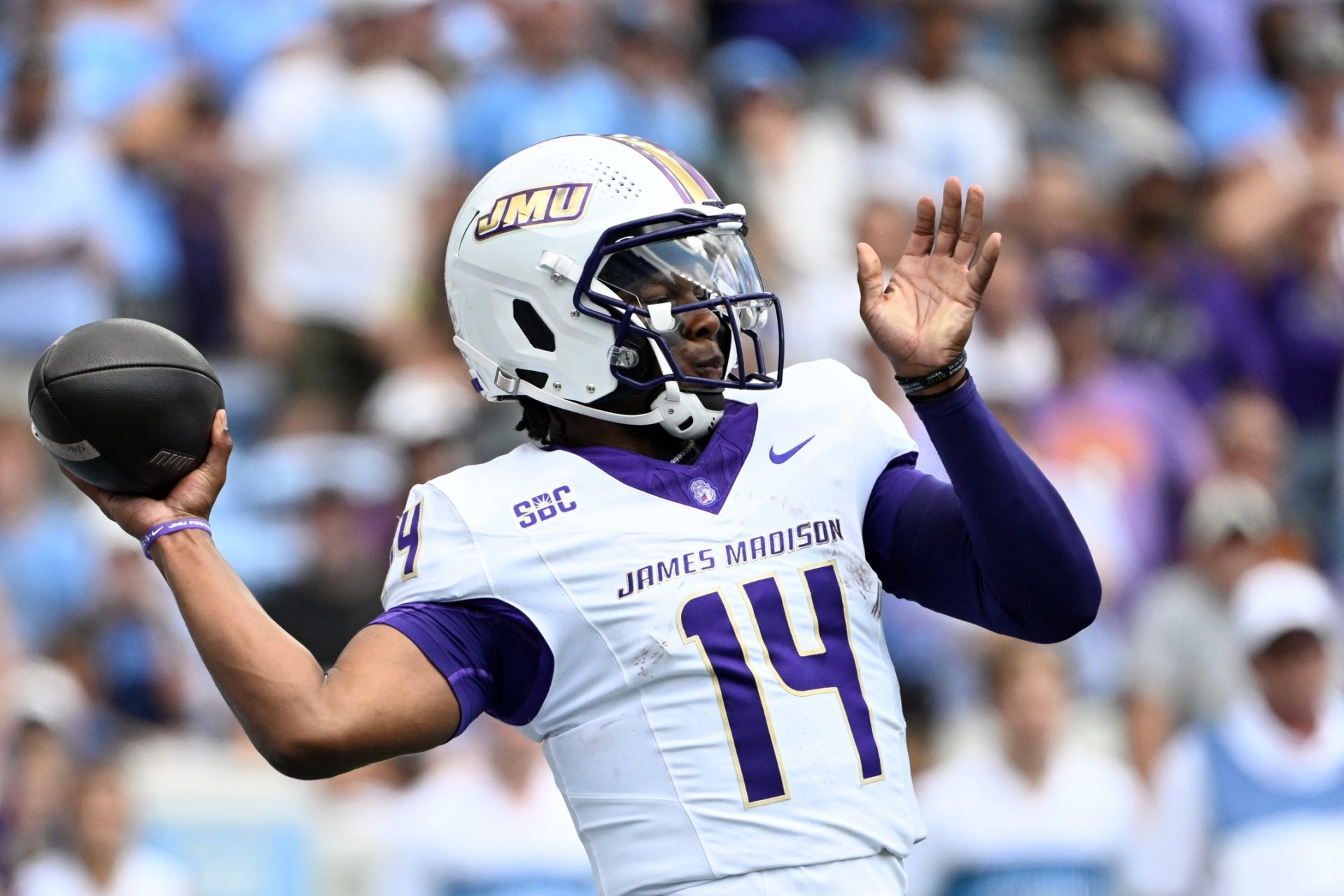 James Madison Dukes quarterback Alonza Barnett III (14) looks to pass in the first quarter at Kenan Memorial Stadium.