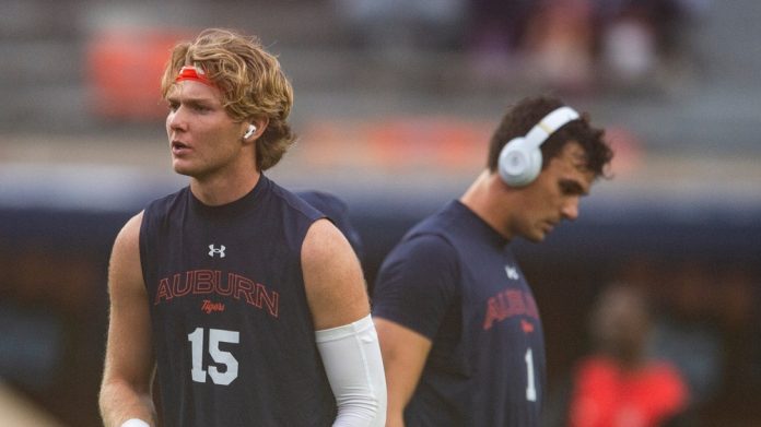 Auburn Tigers quarterbacks Hank Brown (15) and Payton Thorne (1) warm up before Auburn Tigers take on New Mexico Lobos at Jordan-Hare Stadium in Auburn.