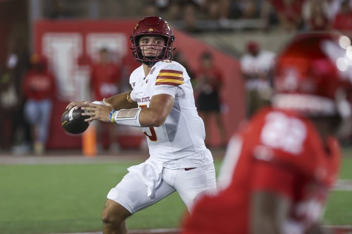 Iowa State Cyclones quarterback Rocco Becht (3) scrambles with the ball during the fourth quarter against the Houston Cougars at TDECU Stadium.