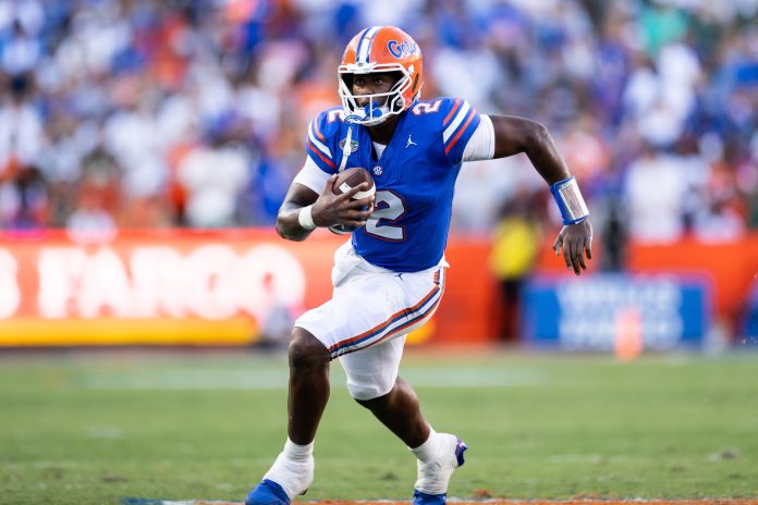 Florida Gators quarterback DJ Lagway (2) runs with the ball against the Miami Hurricanes during the second half at Ben Hill Griffin Stadium. Mandatory Credit: Matt Pendleton-USA TODAY Sports