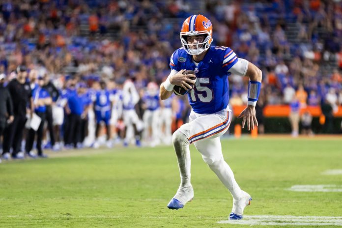 Florida Gators quarterback Graham Mertz (15) rushes with the ball against the Texas A&M Aggies during the second half at Ben Hill Griffin Stadium.