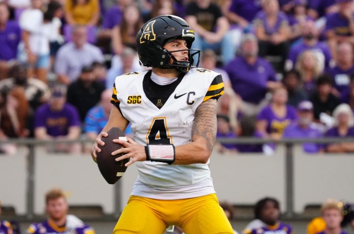 Appalachian State Mountaineers quarterback Joey Aguilar (4) looks down field against the East Carolina Pirates during the second half at Dowdy-Ficklen Stadium. Mandatory Credit: James Guillory-Imagn Images