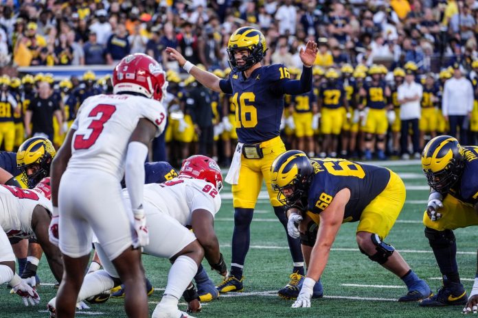 Michigan quarterback Davis Warren (16) starts the game against Fresno State at Michigan Stadium at Michigan Stadium in Ann Arbor on Saturday, Aug. 31, 2024.