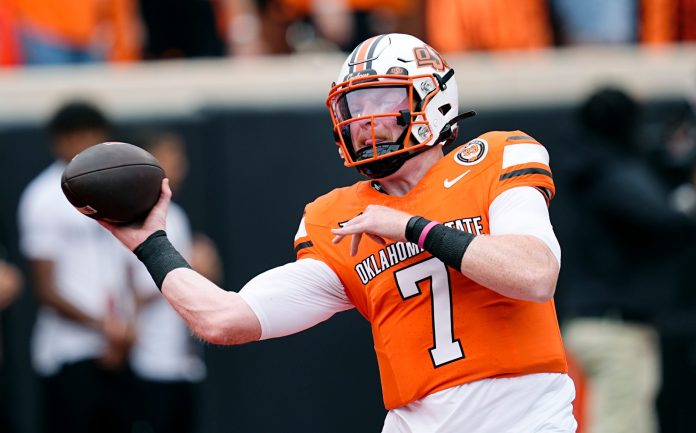 Oklahoma State's Alan Bowman (7) throws a pass during warm-ups before the college football game between the Oklahoma State Cowboys and South Dakota State Jackrabbits at Boone Pickens Stadium in Stillwater, Okla., Saturday, Aug., 31, 2024.