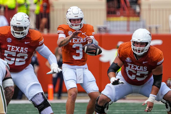 Texas Longhorns quarterback Quinn Ewers (3) snaps the ball during the game against Colorado State at Darrell K Royal-Texas Memorial Stadium in Austin Saturday, Aug. 31, 2024.